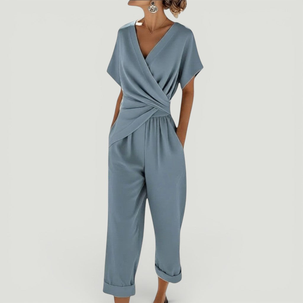 Conjunto de duas peças VIESTI azul com blusa envolvente e calças de corte elegante para um visual sofisticado.